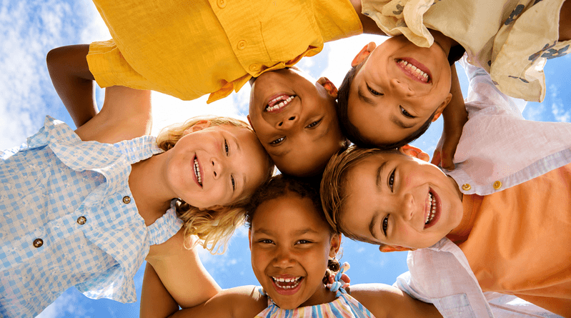 Children smiling together at a school holiday activity