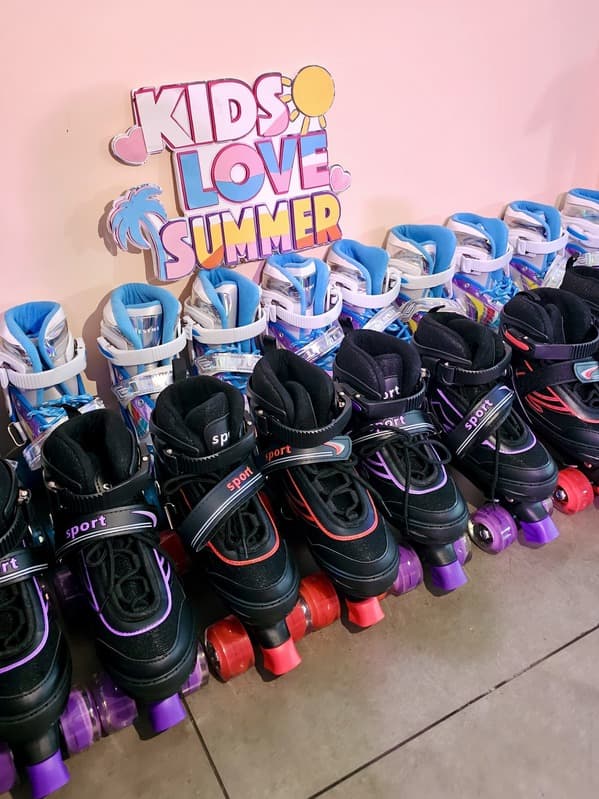 Rows of roller skates ready for a Kids Love Summer party